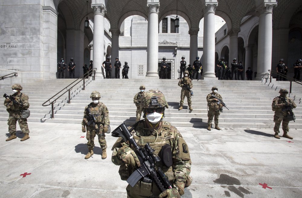 Members of California National Guard stand guard outside the City Hall