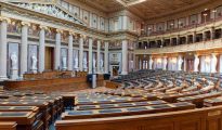 Interior view of the National Council plenary chamber inside the historic Austrian Parliament building.