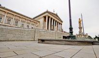 The historic Austrian Parliament building on Vienna's Ringstraße with the Pallas Athene fountain in front.