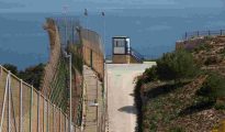 High perimeter security fence running along the border of the Spanish enclave of Ceuta.