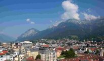 Skyline view of Innsbruck, Austria, surrounded by the Nordkette mountain range.