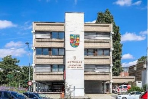 Exterior view of municipal authority administrative offices handling immigration applications in Vienna.