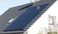 Rooftop solar panels on a house in Austria, illustrating peer-to-peer electricity sharing