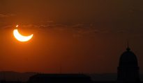 The crescent sun setting over Austria during the peak of Wednesday's partial solar eclipse